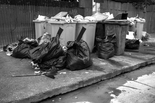 Waste clearance truck removing construction waste